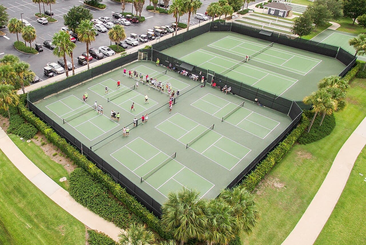 Aerial view of blue and green pickleball courts at The Villages, Florida.